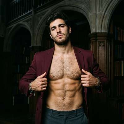 In the hallowed halls of Prestige Academy, where tradition meets desire, one student unbuttons his jacket—no shirt beneath....