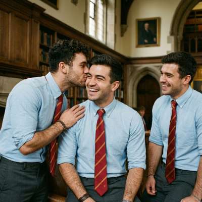 Whispers of camaraderie echo through the grand halls—where ink-stained tomes meet unspoken promises. A scholar’s kiss,...