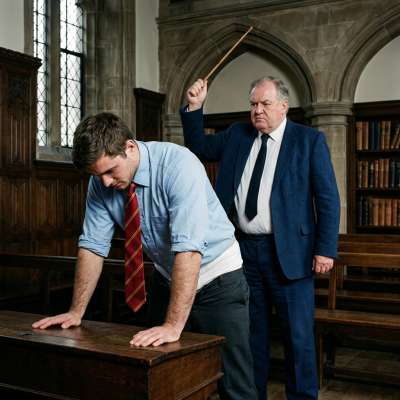 A scholar’s lesson in humility—bending over ancient wisdom while the weight of tradition looms. The unspoken rules of an...