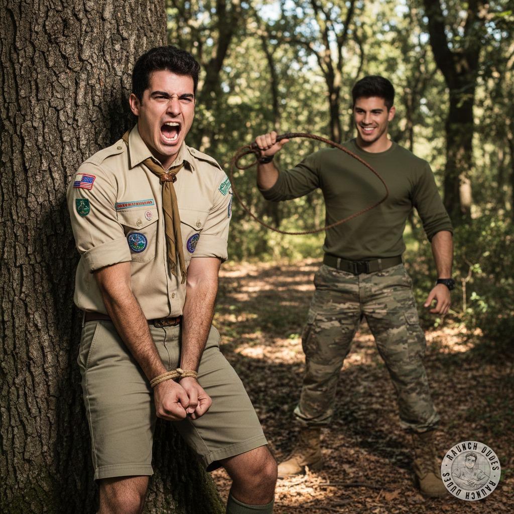 Rough and ready in the woods—this scout’s tied to a tree, begging for the military man’s leather whip. The crack of the...