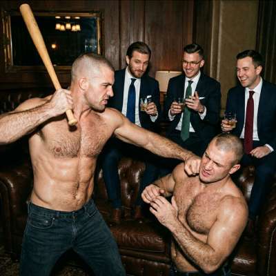Three businessmen watch as two skinheads beat the hell out of each other—pure power, pure submission. The room reeks of...