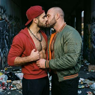 Rough boy & a skinhead lock lips, tongues deep in each other’s mouths, spit dripping down chins like cum on a fucking...
