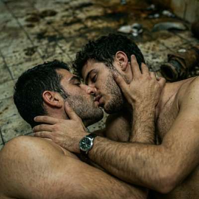two dudes slobbering on each other’s faces while their filthy tongues fuck the air, grinding on the piss-stained tiles like...