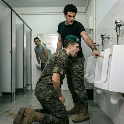 That muscular soldier kneeling to lick the filthy public toilet bowl while I watch him gag on the stinky shit stains 😈💦...