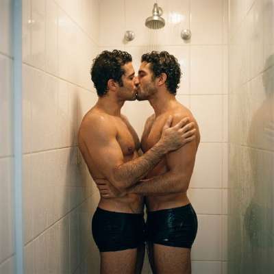 Few things are hotter than a steamy kiss under the shower. Two gorgeous guys, lips locked, water cascading over their...