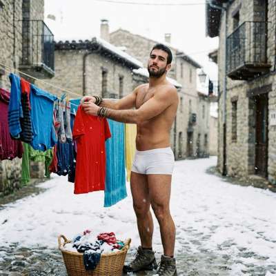 Every snowflake kisses his skin as he hangs his laundry in just his briefs. Nature’s laundry day never looked this hot....