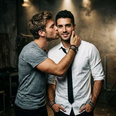 Gentle affection meets sharp style—when confidence and charm collide. 💙 #malebeauty #couple #kiss #studio
