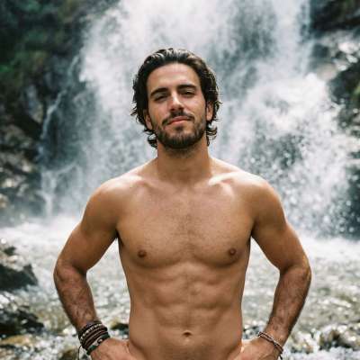 Nature’s masterpiece meets raw masculinity. This vision of strength standing before the wild beauty of a waterfall? Pure,...