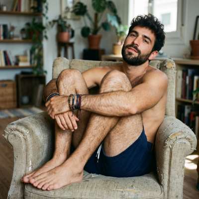 Confidence and charm in every pose—effortlessly striking in his own space. 🌟 #malebeauty #bedroom #hairy