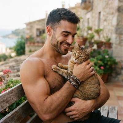 Nothing quite matches the charm of a strong, tender moment—like this Adonis cradling his feline companion. Pure, effortless...